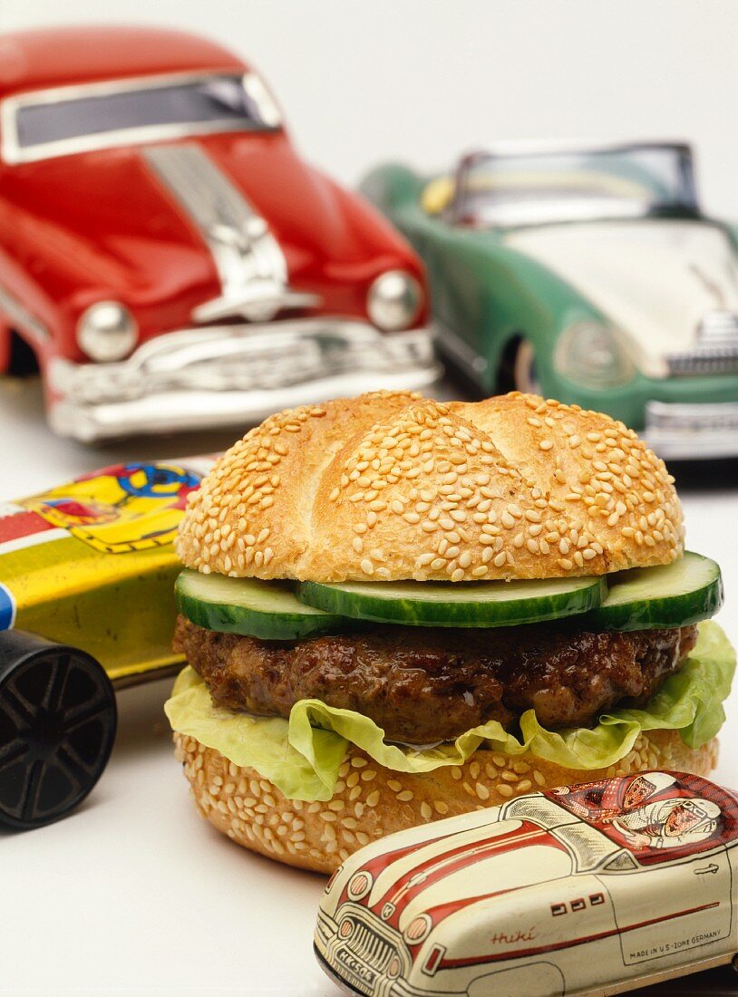 A hamburger, decoration: American toy cars