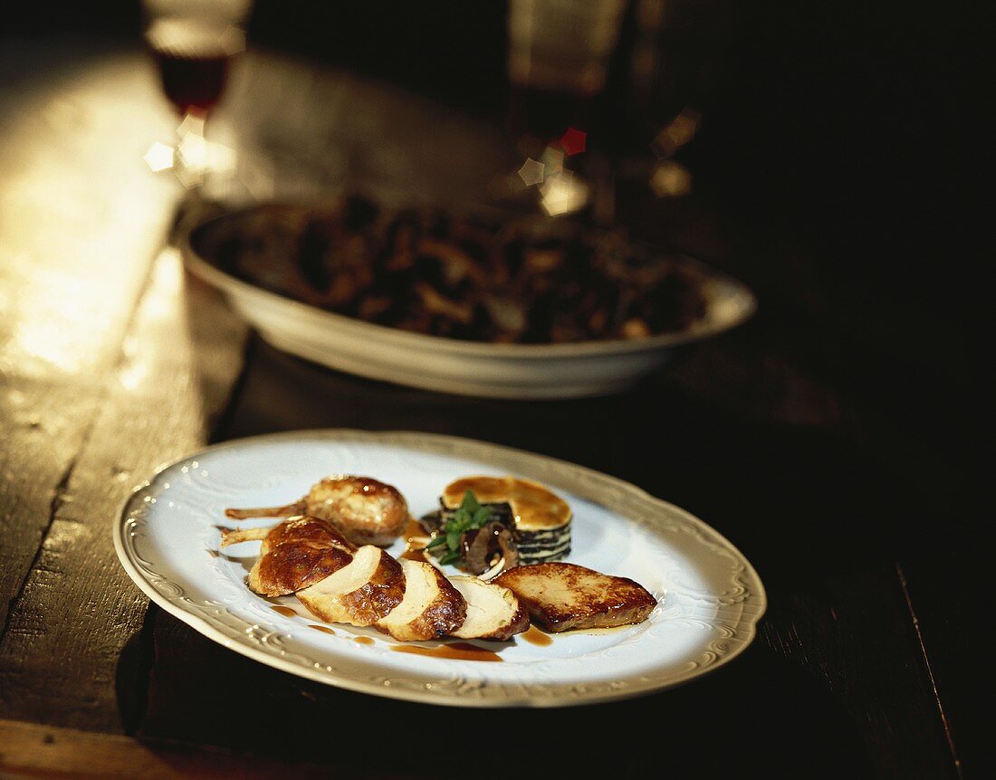 Sliced partridge breast with goose liver and mushroom flan