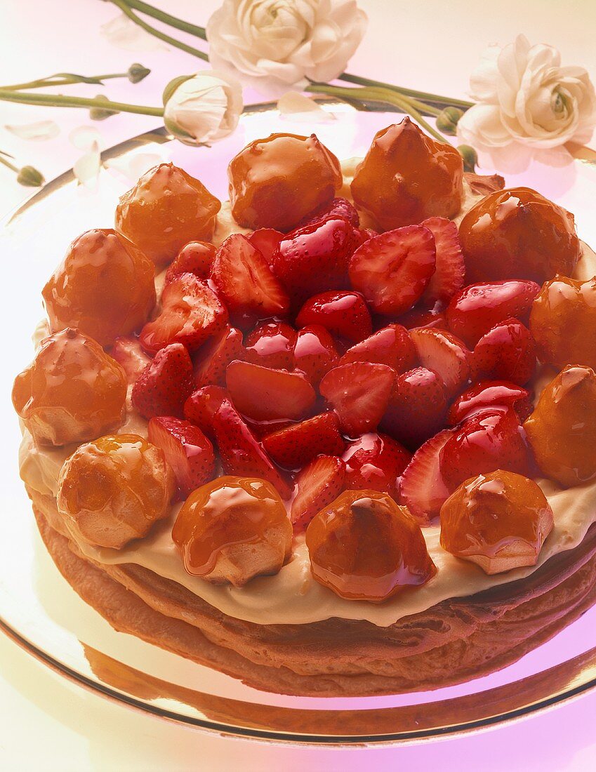Choux pastry strawberry gateau with vanilla cream, profiteroles