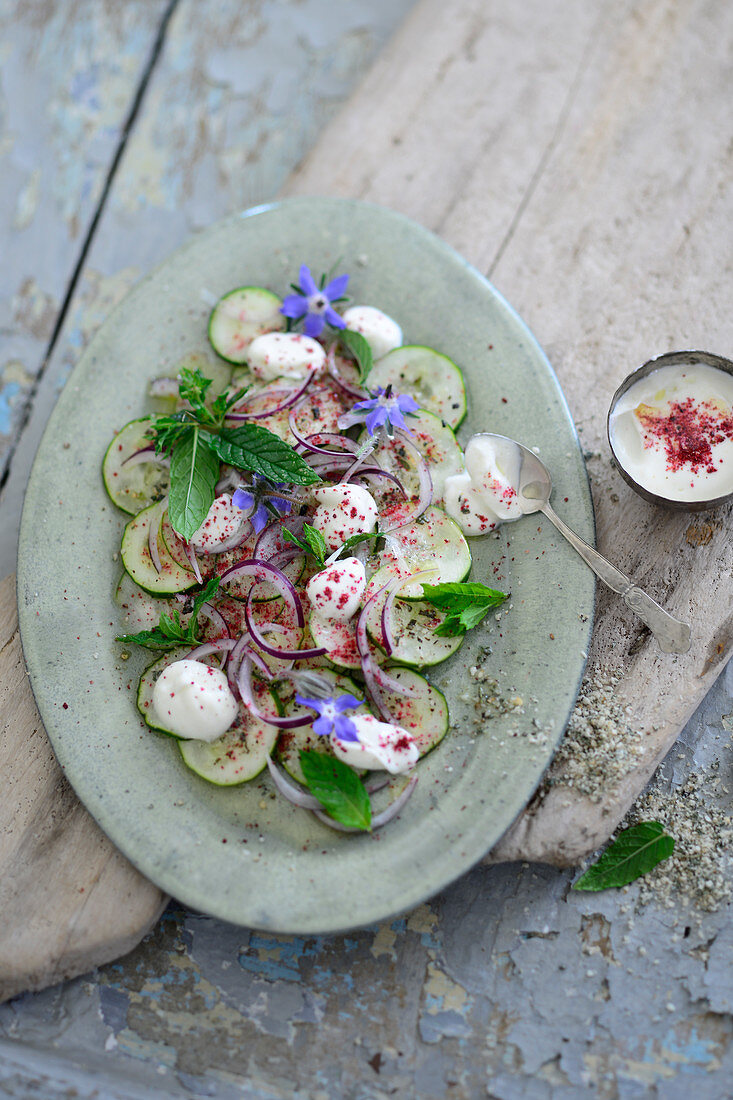 Cucumber salad with yoghurt and red onions