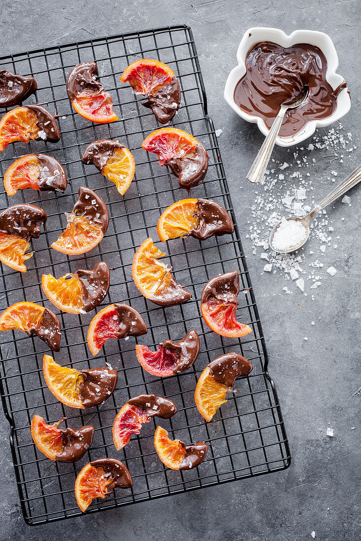 Candied blood oranges dipped in chocolate and sprinkled with finger salt