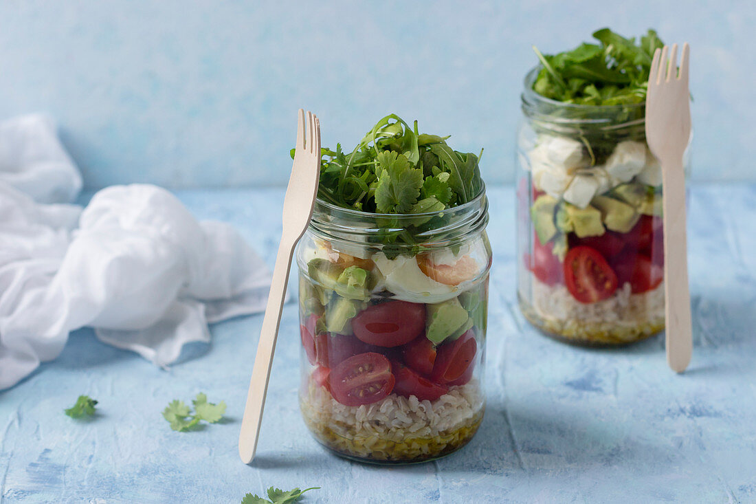 Salads in a jar with grains, vegetables and boiled egg