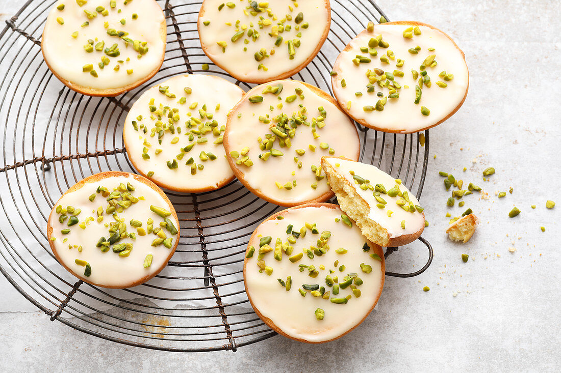 Amerikaner (soft, sponge cake-like shortbread) topped with pistachios