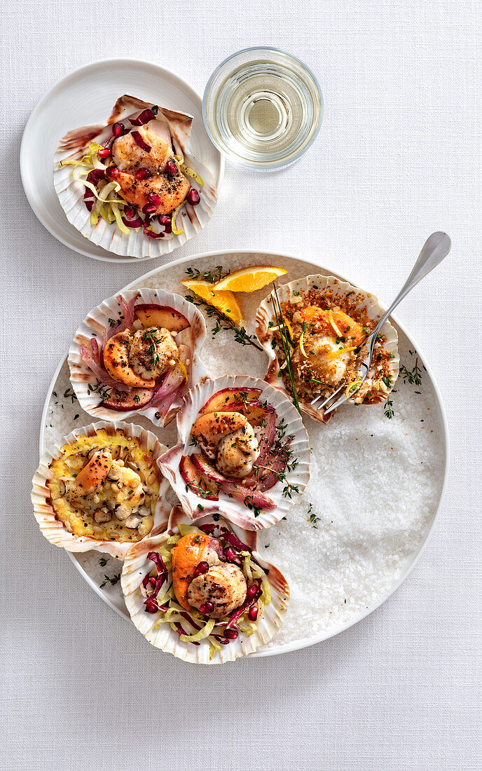 Roasted scallops with fruit, herbs and vegetables