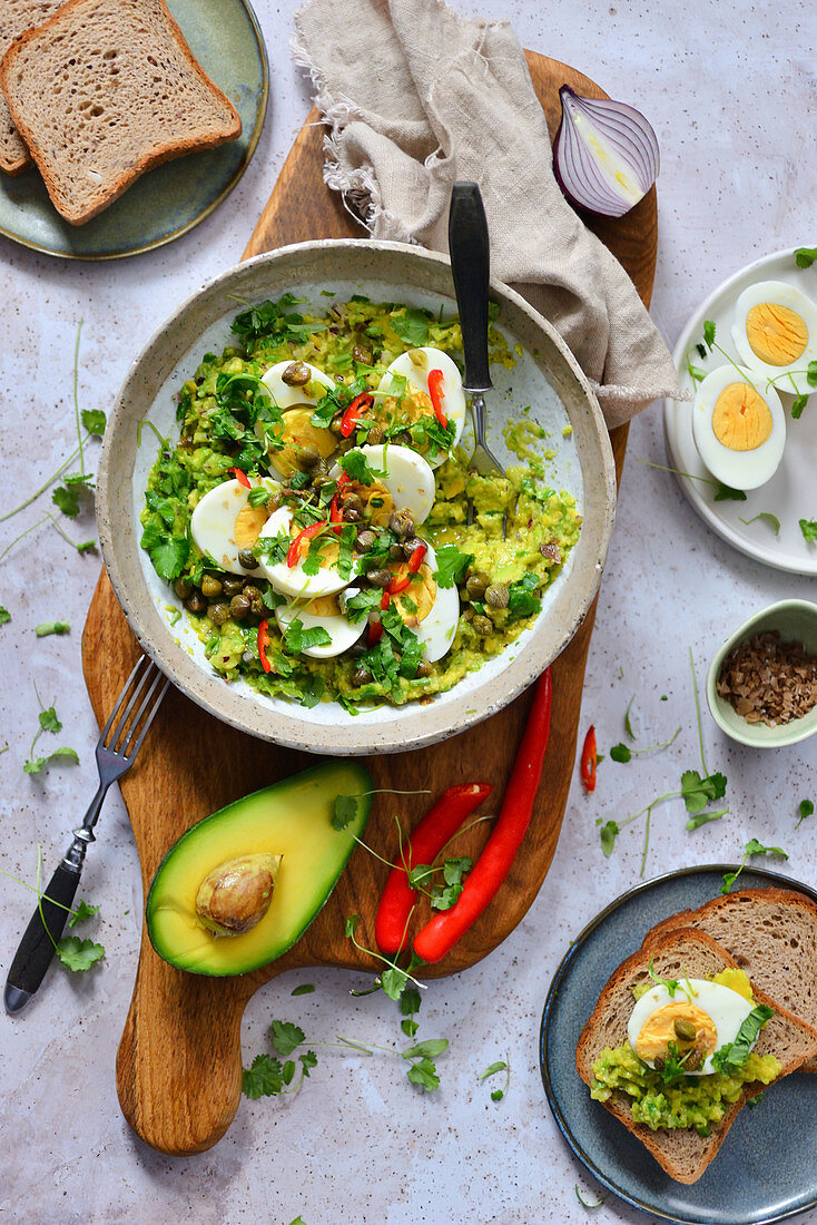Salad with avocado eggs coriander and chilli