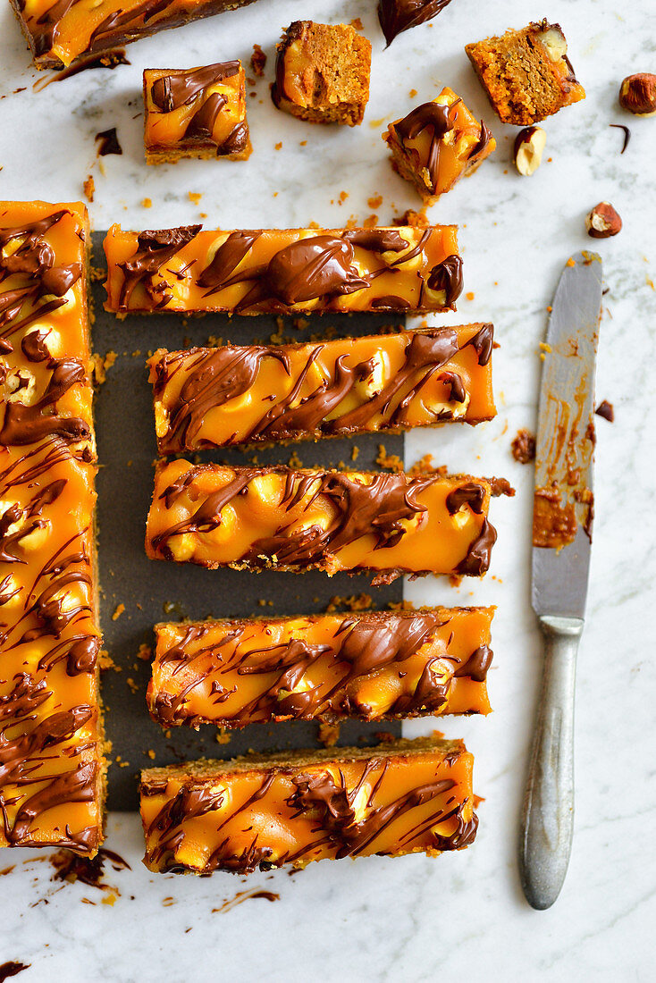 Cake in the form of bars with caramel nuts and chocolate