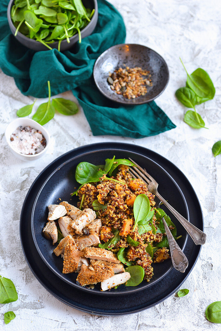 Dietary chicken porridge with sweet potatoes and spinach on a plate