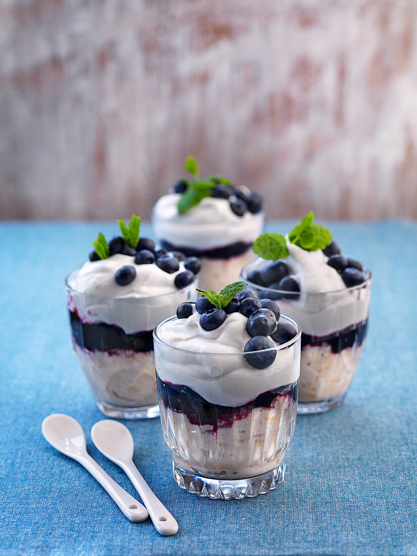 Vegan dessert with whipped cream, bluberries and bluberry jam