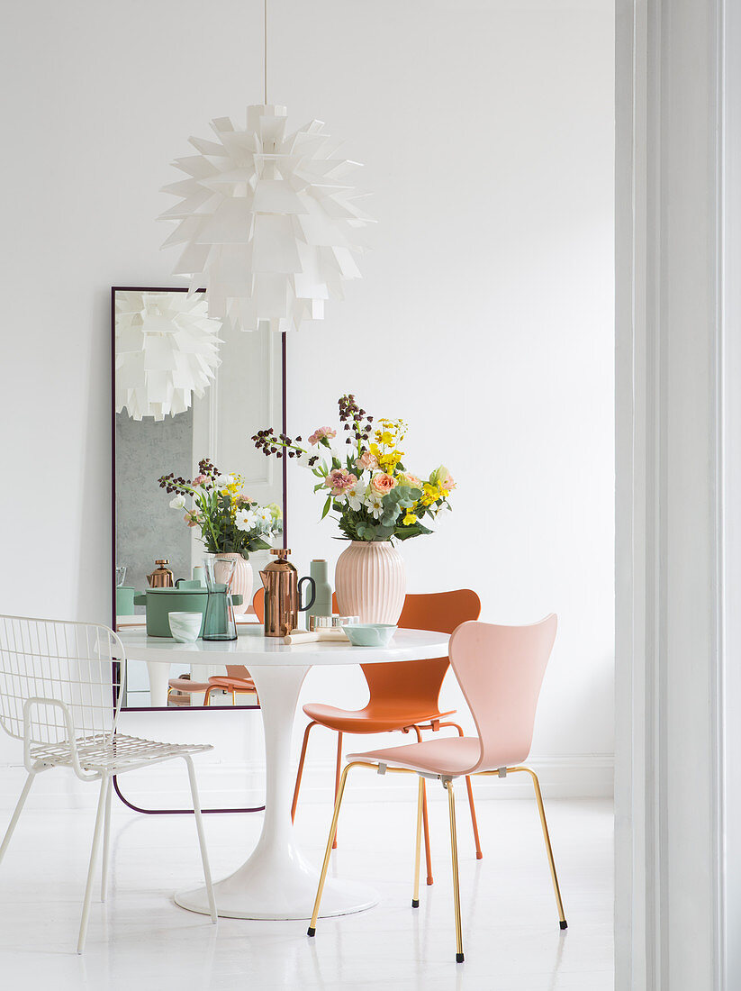 Vintage-style designer furniture in white, feminine dining room