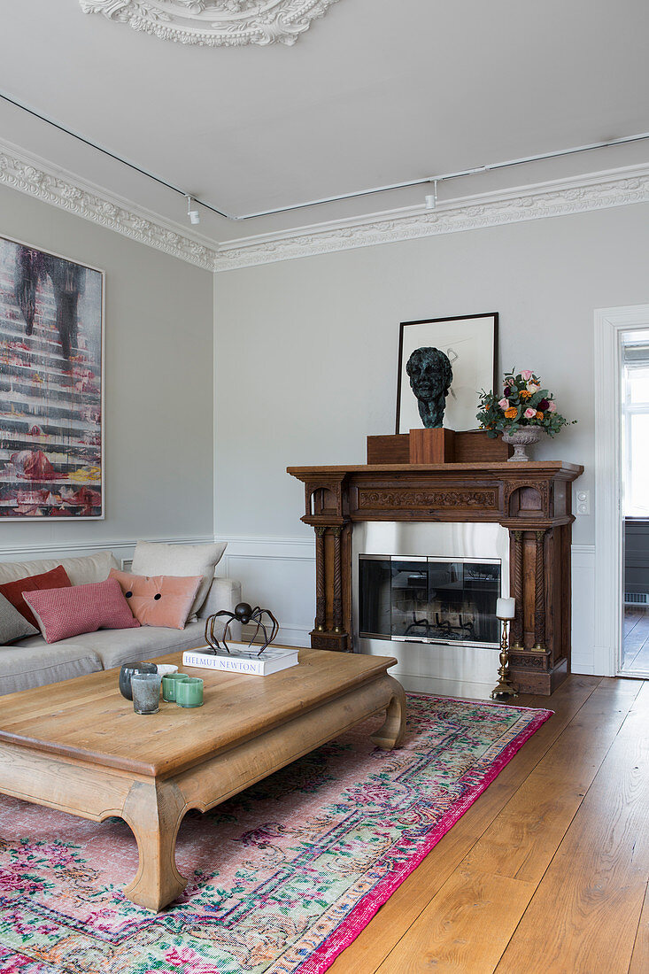 Opium table in living room with stucco ceiling and open fireplace