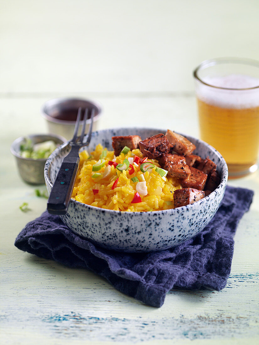 Marinated and fried tofu with saffron rice