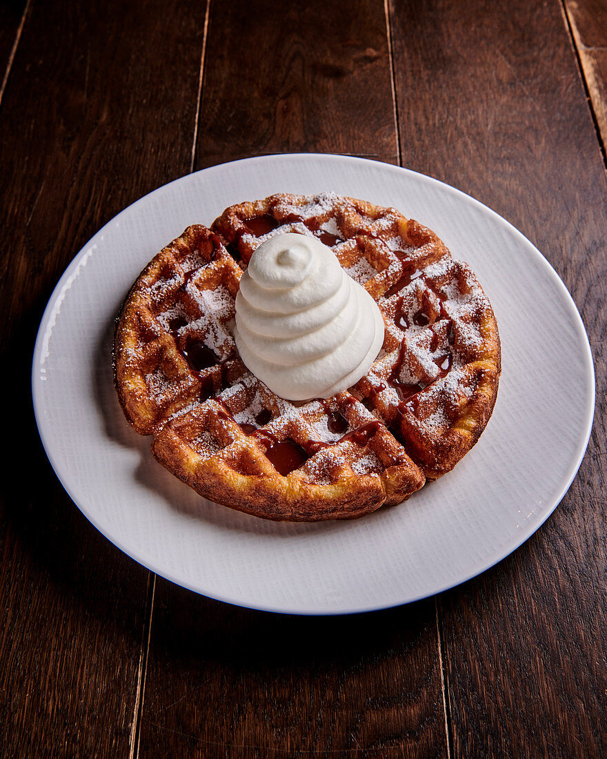 Waffles with cream and icing sugar