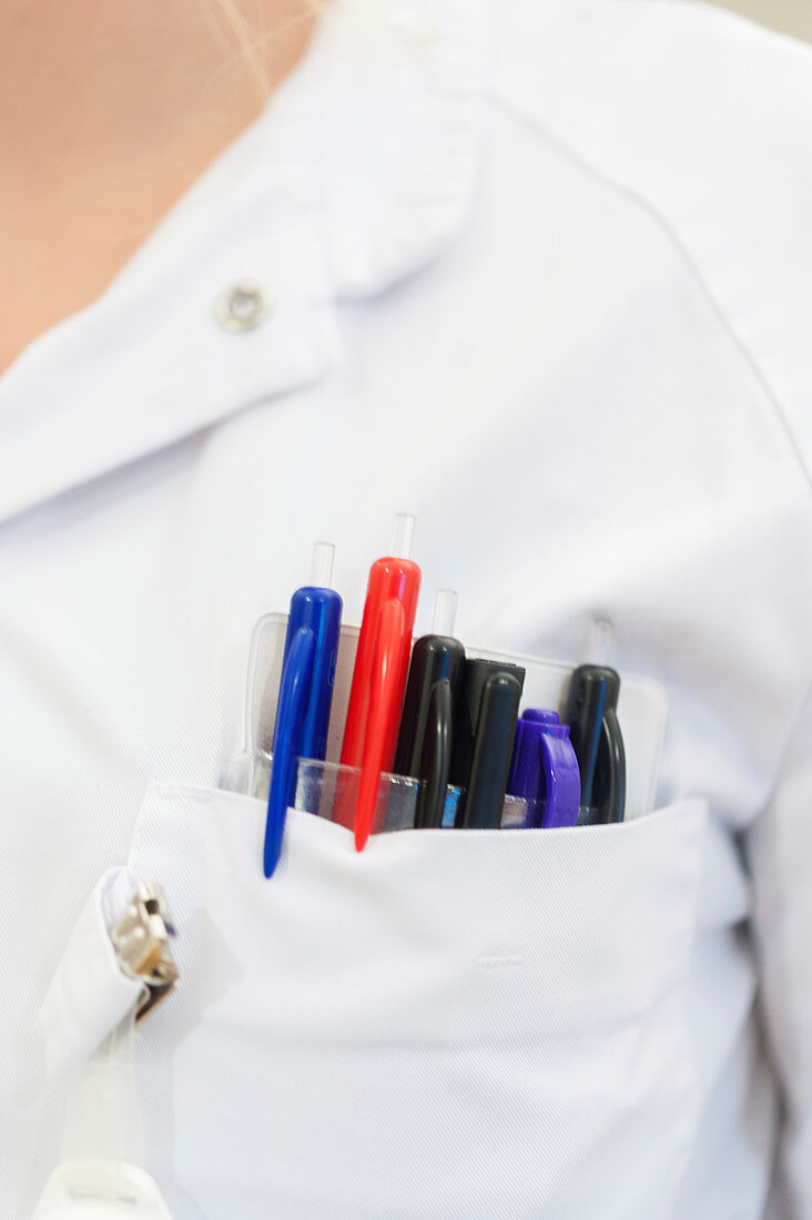Pens in a nurse's pocket, close-up