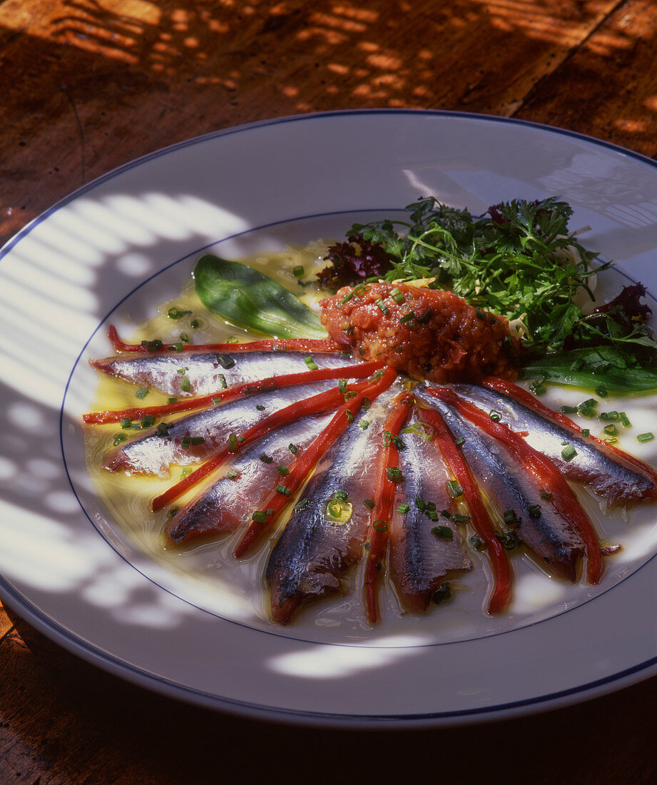 Marinated anchovies with tomato tartare