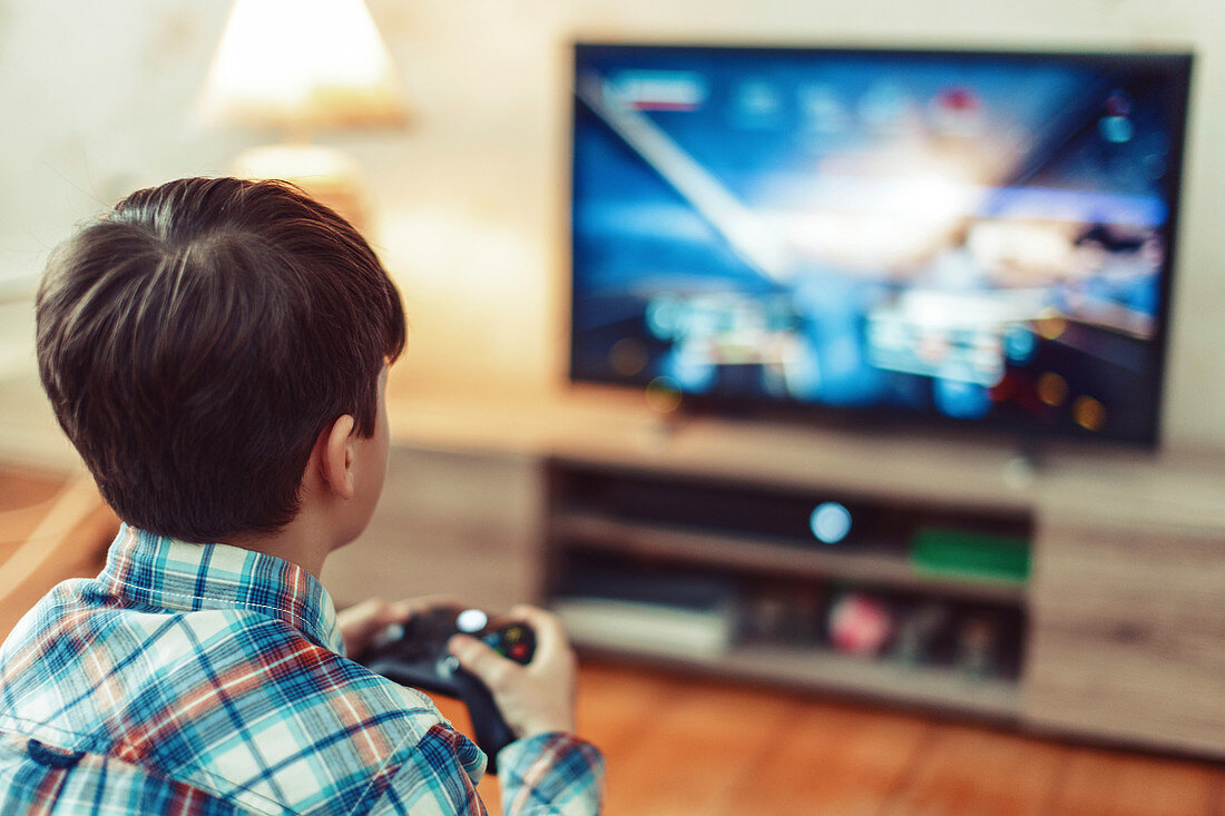 Young boy playing video game