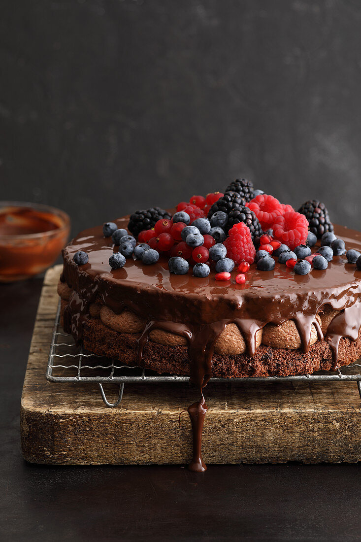 Creamy chocolate naked cake with fresh berries