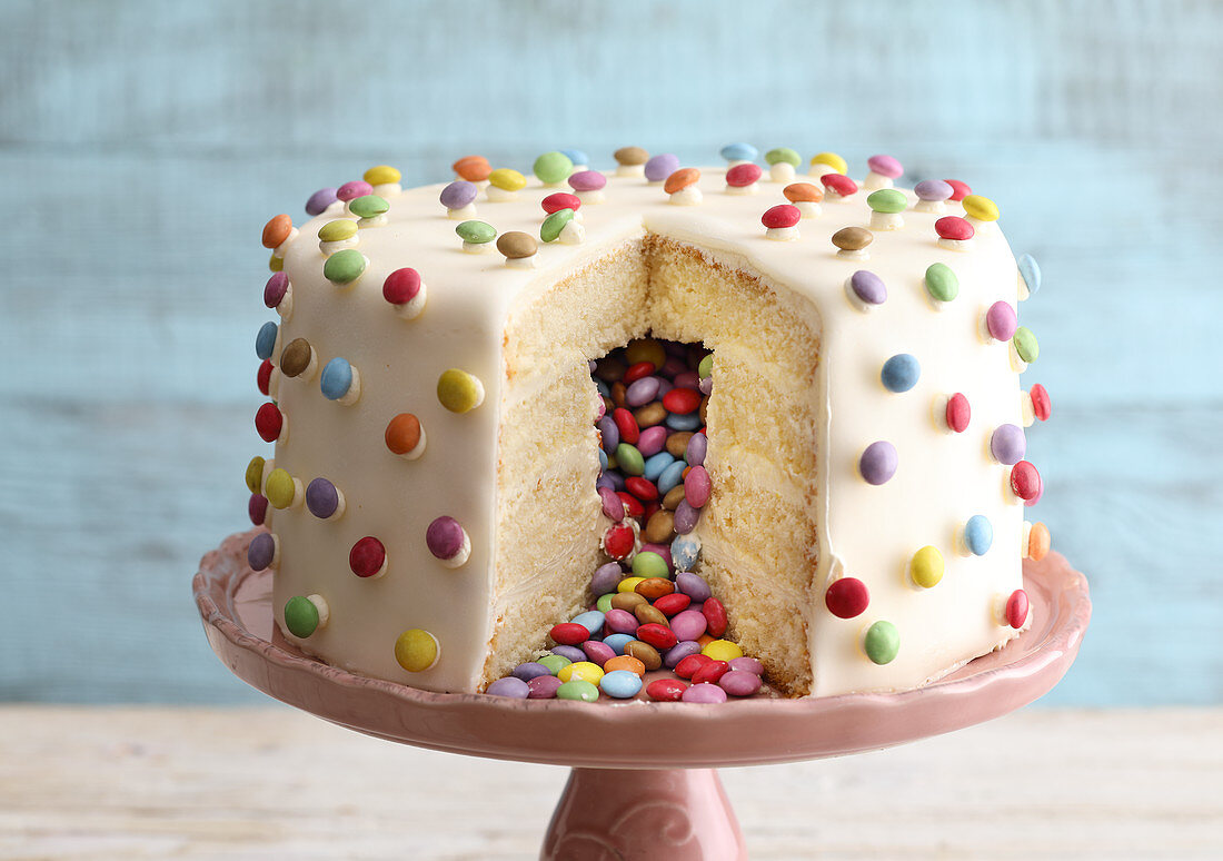 A pinata cake filled with colourful chocolate beans