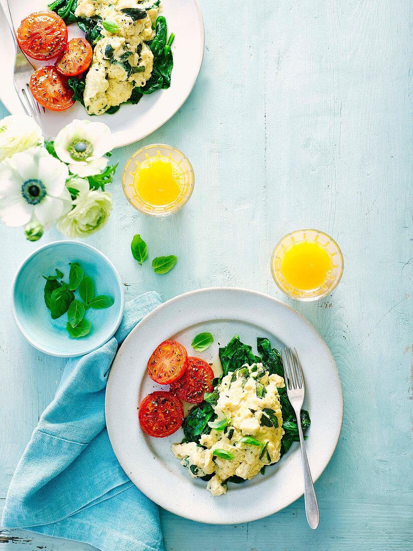 Basil scramble with wilted spinach and seared tomatoes