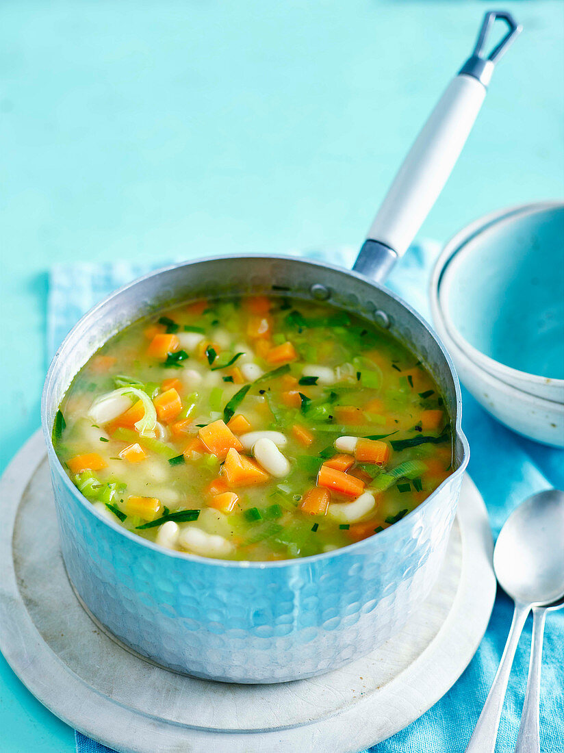 Summer carrot, tarragon and white bean soup