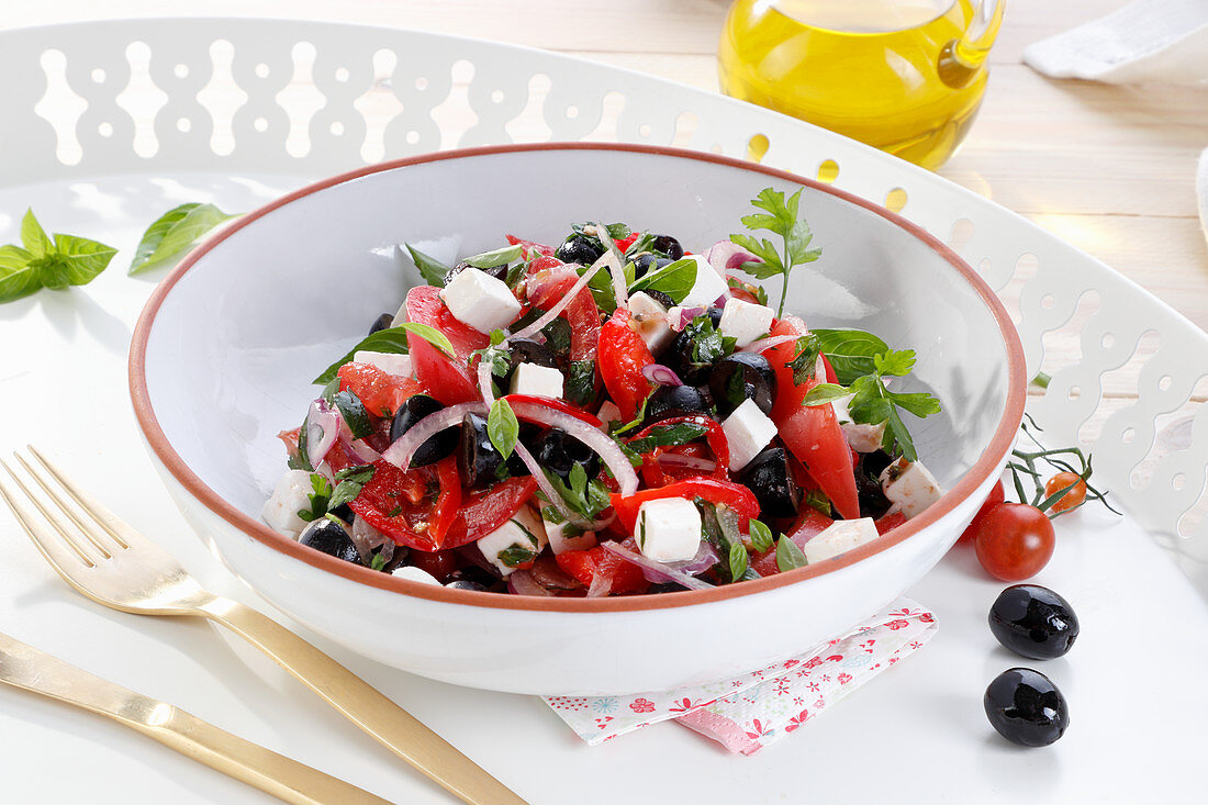 Summer salad with feta cheese, tomatoes and olives