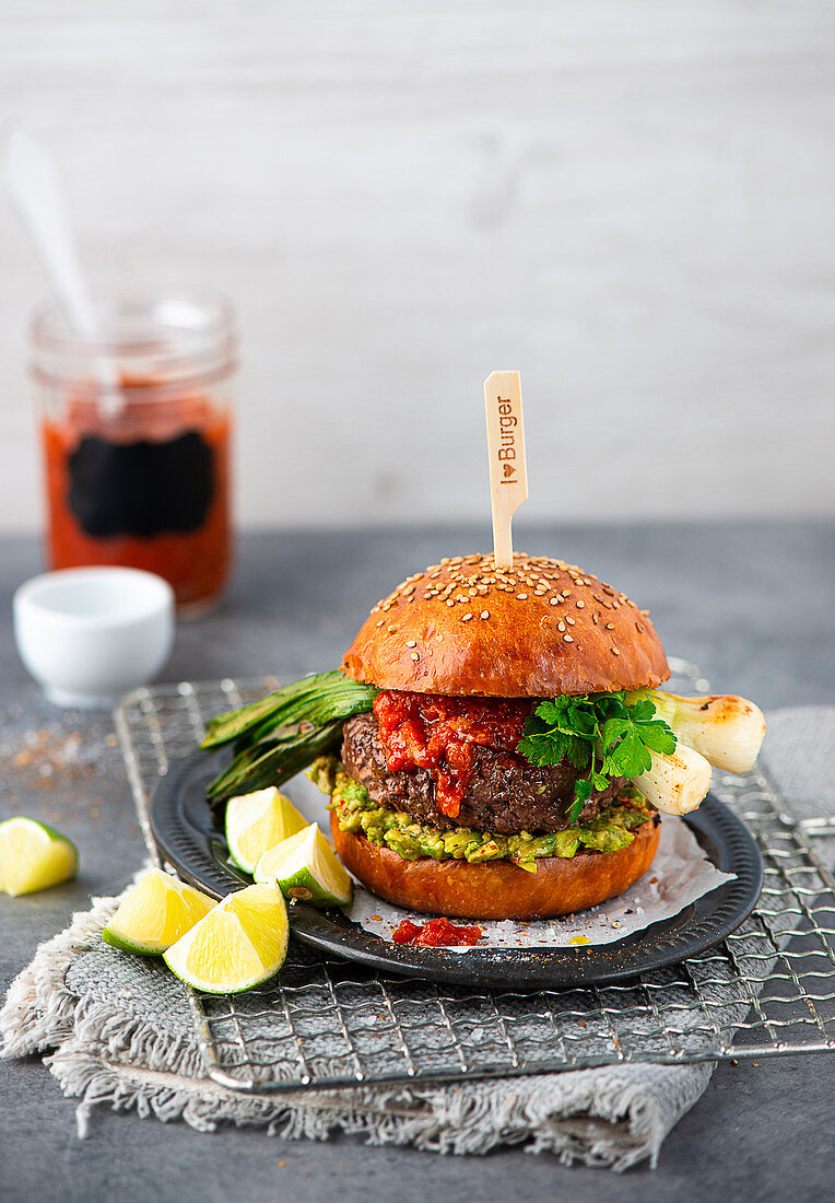 Burger with avocado and spring onions