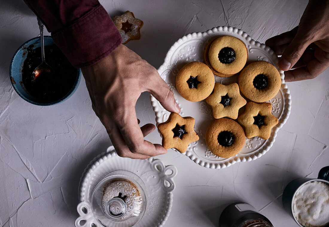 Placing Linzer cookie on a plate