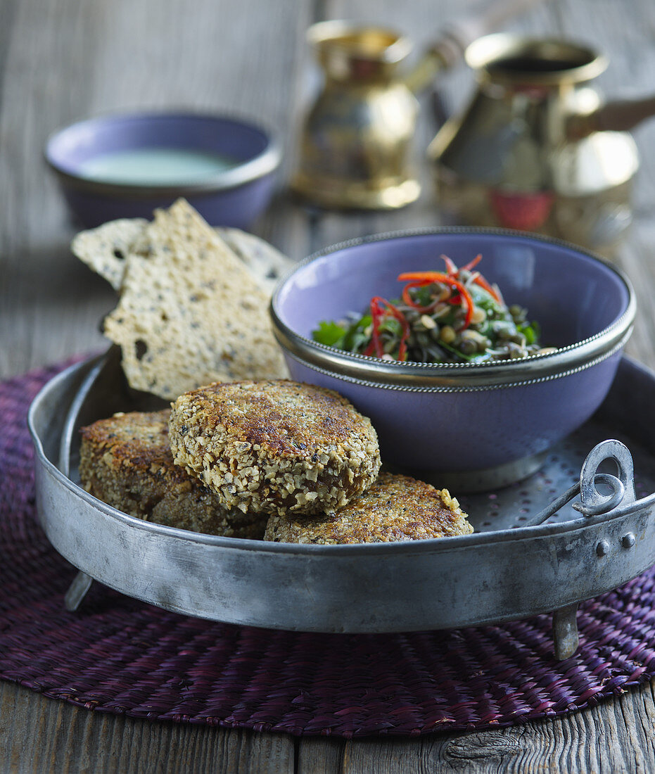 Lamb kebabs with mint sauce and lentil salad
