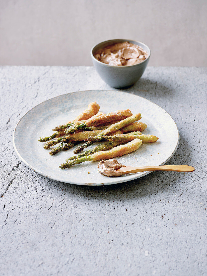 Butter-fried asparagus with black olive and lemon mayonnaise