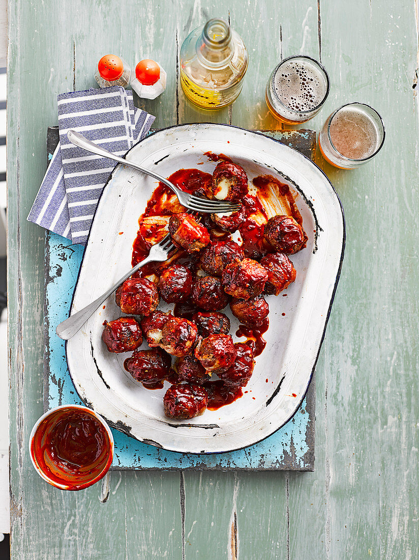 Bacon-wrapped, cheesestuffed, smoky BBQ meatballs