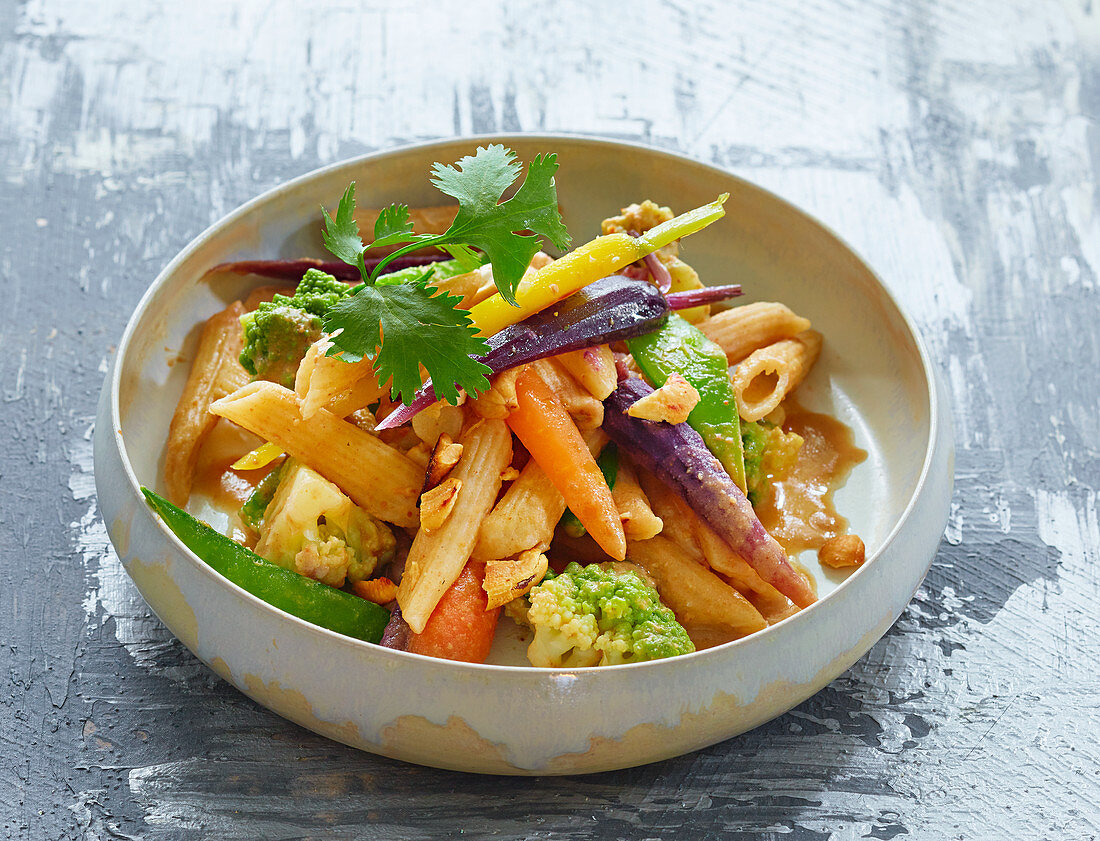 Whole grain pasta with colorful carrots