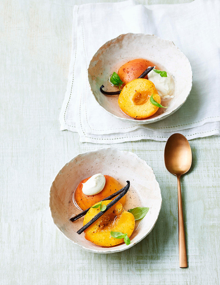 Poached peaches in sparkling wine with basil and vanilla