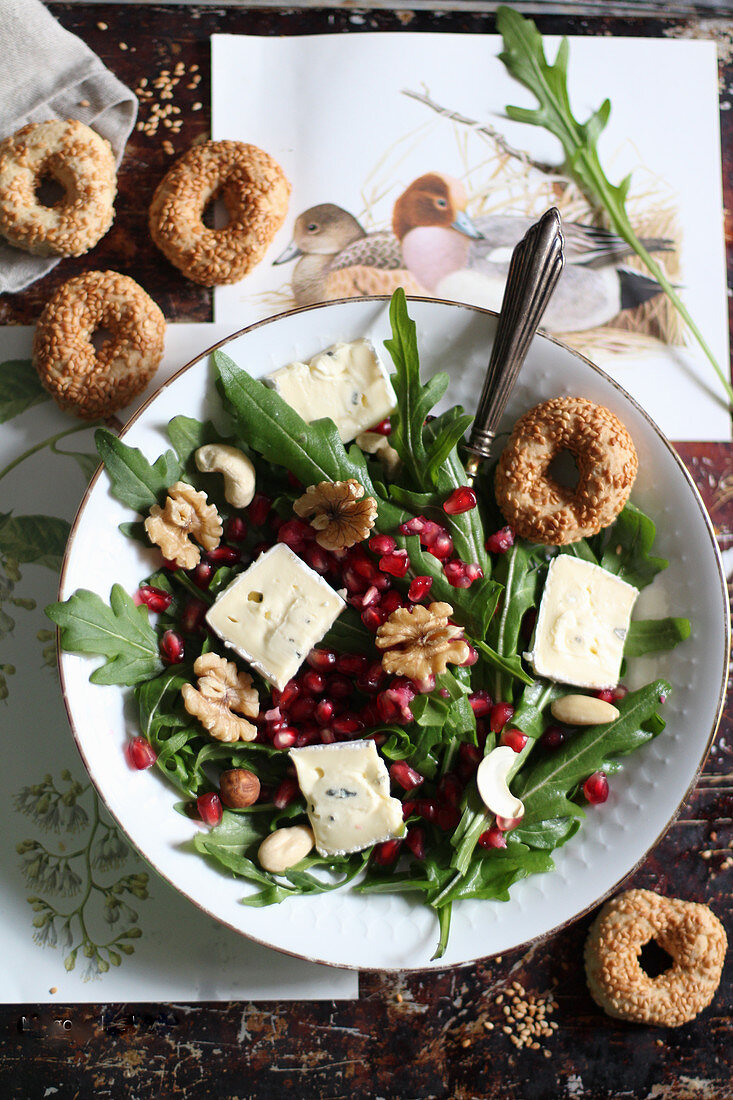 Rocket salad with blue cheese, walnuts and pomegranate seeds
