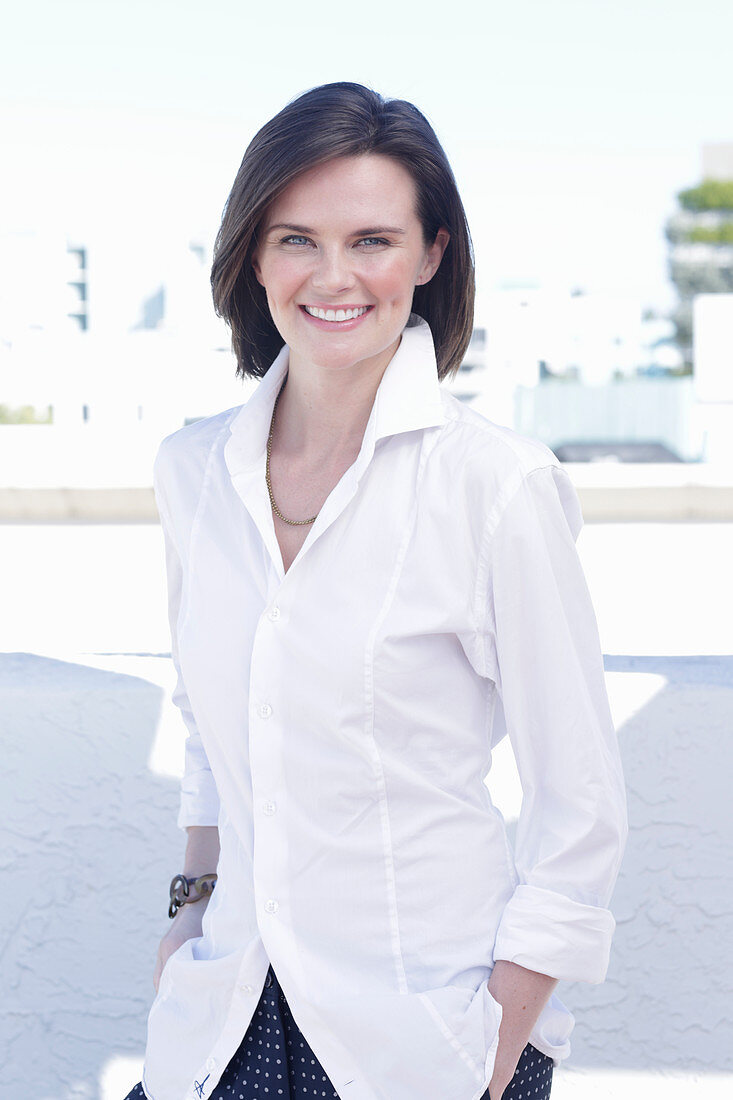 A young woman wearing a white shirt