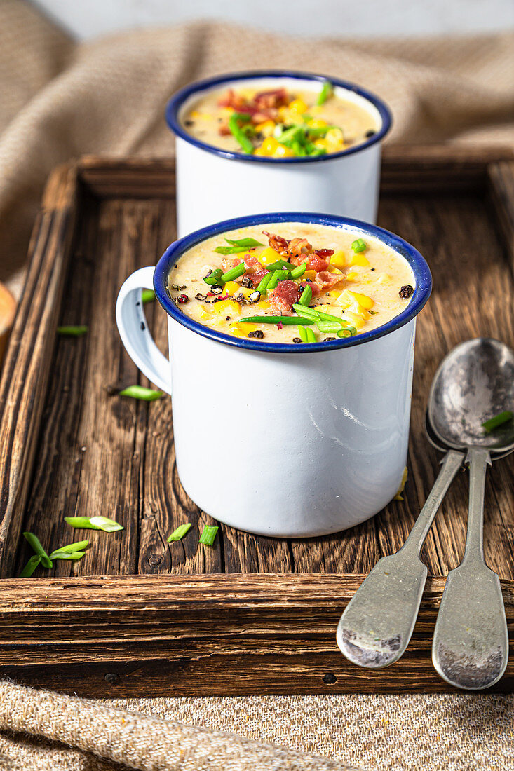 Chicken and corn chowder, served with bacon and chive
