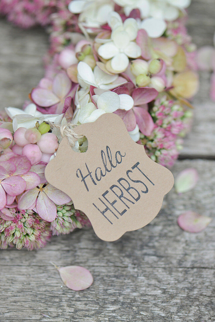 Autumn wreath of hydrangea flowers, sedum, and snowberries