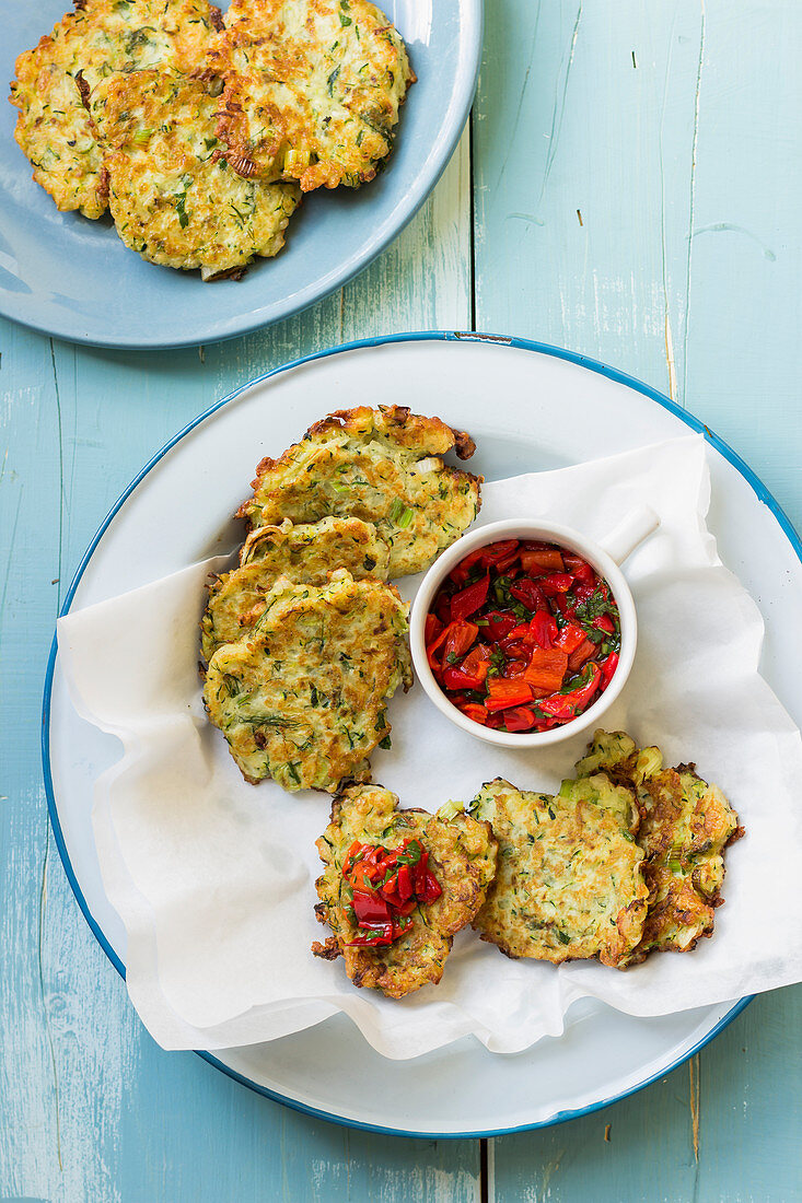 Halloumi and zucchini fritters with red pepper and parsley salsa