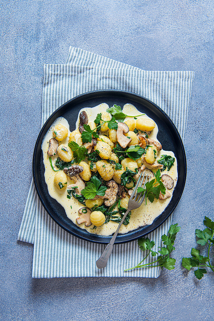 Potato gnocchi with creamy garlic mushrooms sauce and spinach