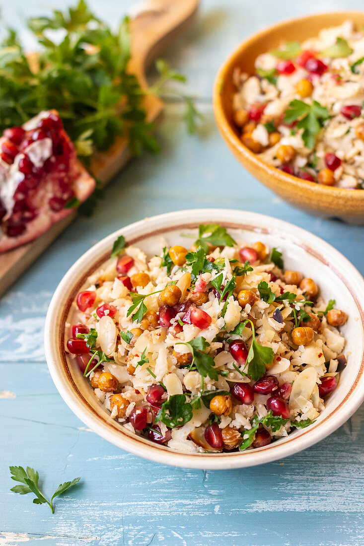 Cauliflower cous cous with chickpeas, pomegranate, almond flakes and parsley