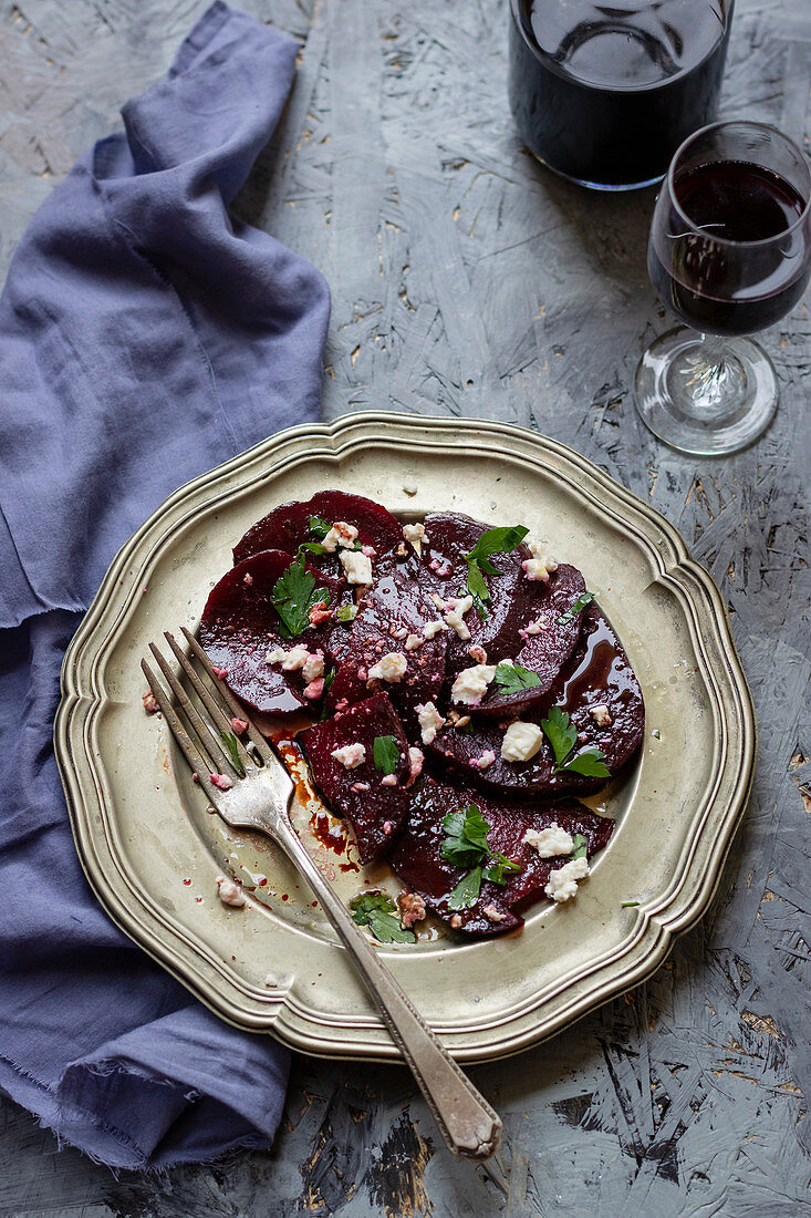 Beetroot carpacio with feta, parley and balsamic dressing, red wine