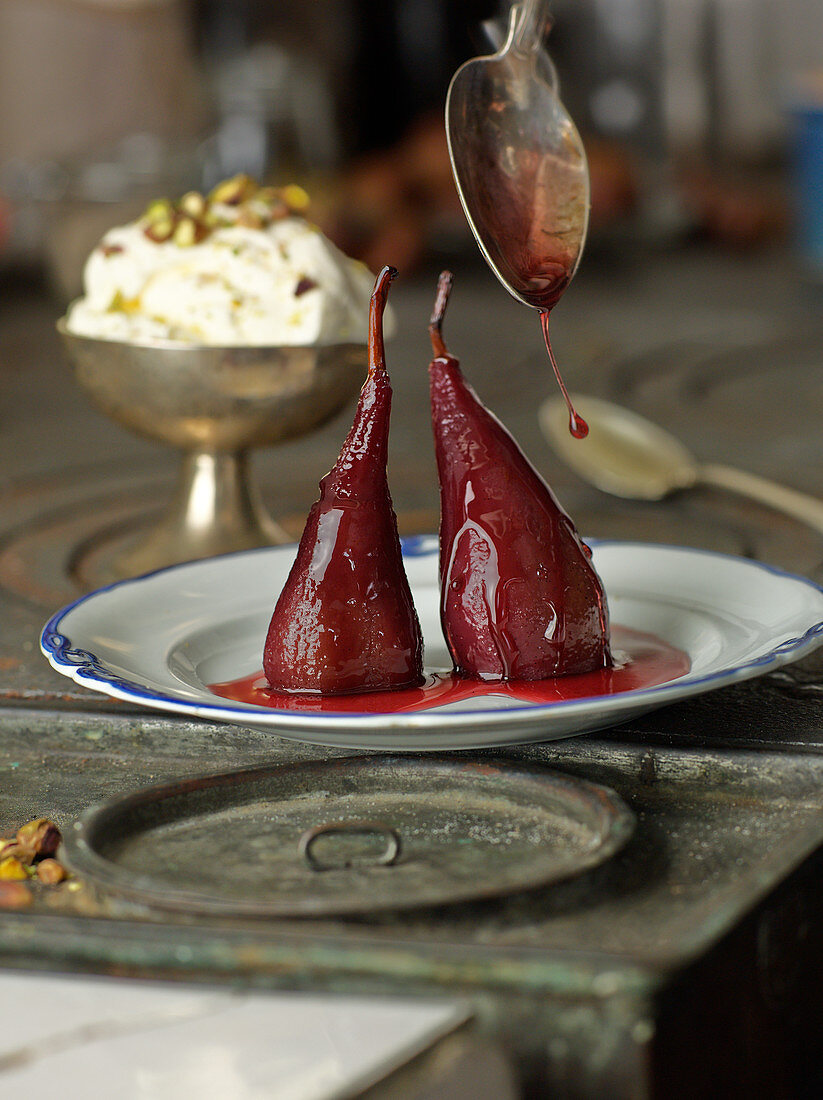Red wine pears with pistachio ice cream