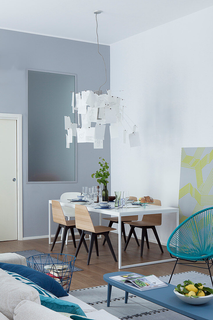 Modern designer lamp above dining table in loft apartment