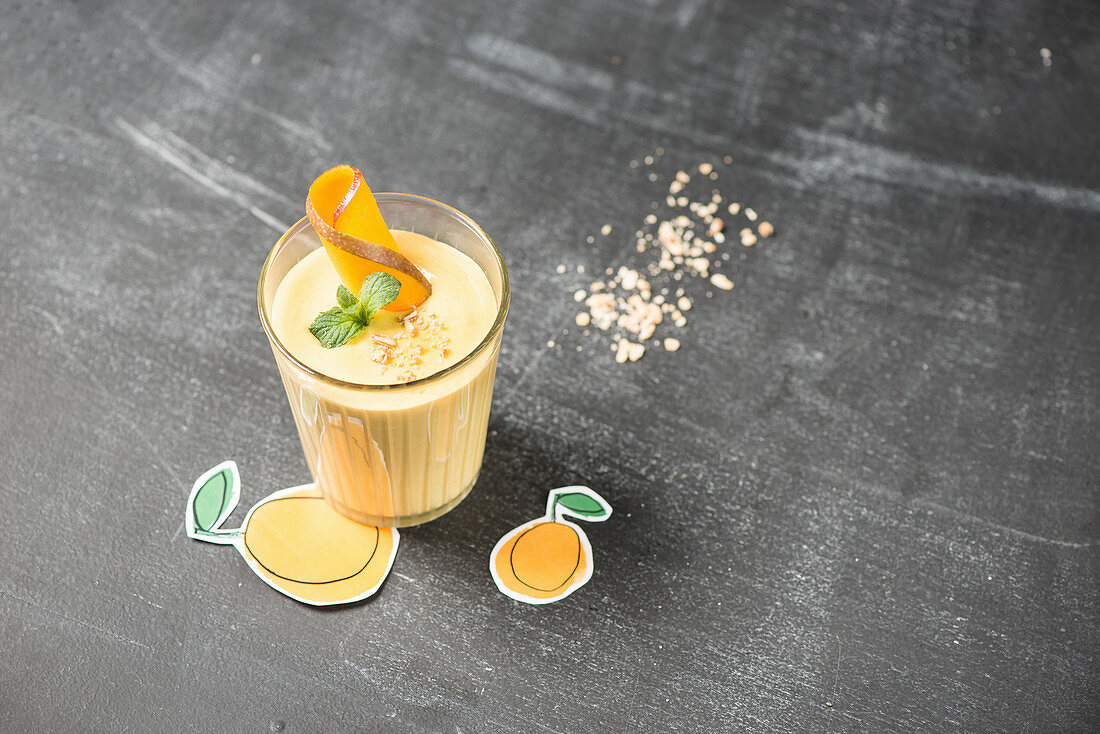 A mango smoothie in a glass