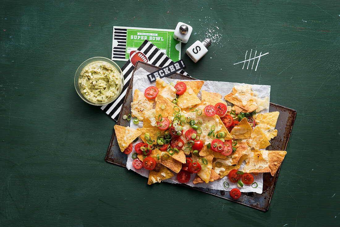 Nachos with guacamole for a Super Bowl party