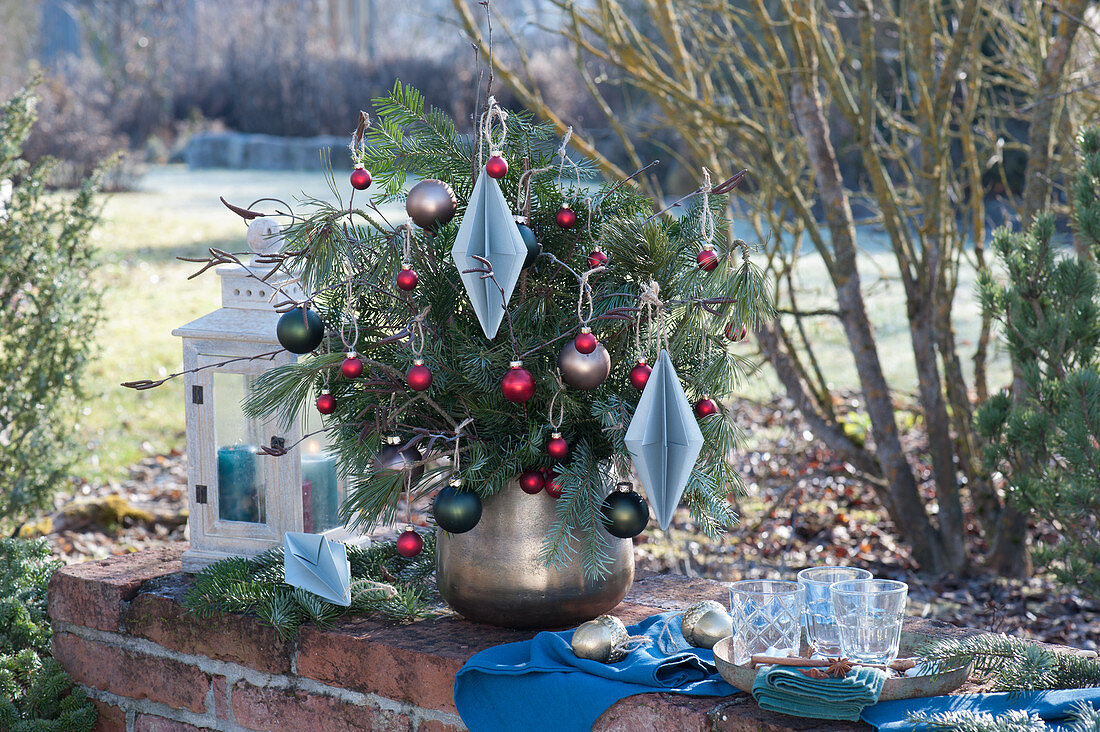 Christmas bouquet made of branches of fir, pine and birch, decorated with balls and diamonds