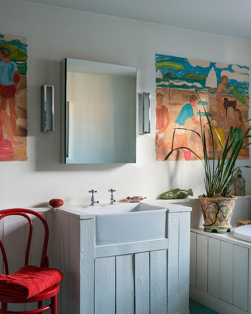 Wood-clad sink, bathtub and wainscoting in bathroom