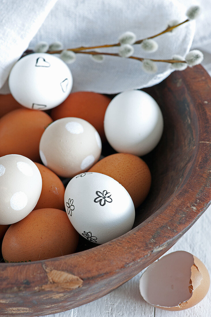 Blown white eggs decorated with stamped motif