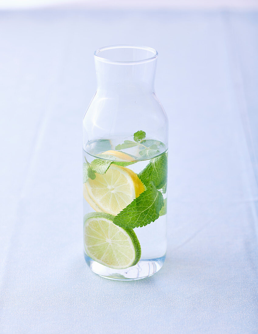 Citrus water with mint in a carafe
