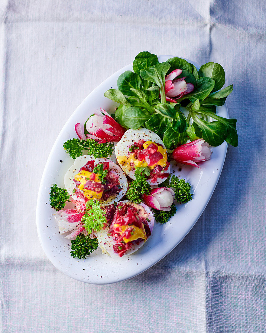 Stuffed eggs with radishes and lamb's lettuce