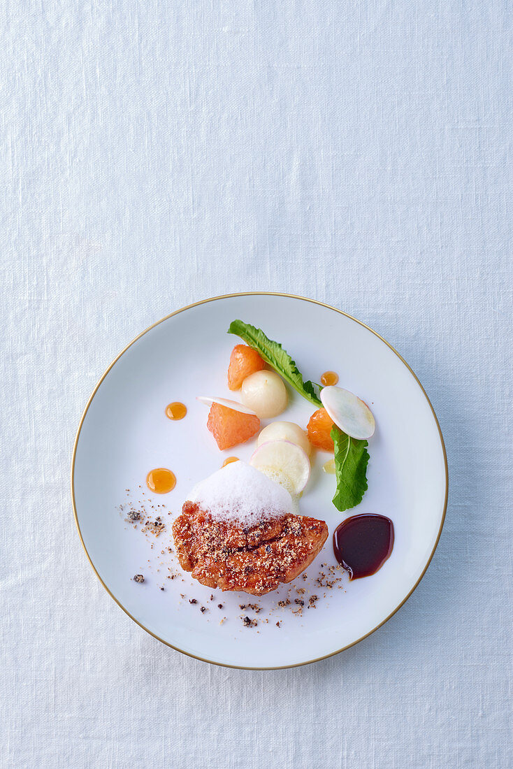 Veal sweetbread with vegetables and a frothy sauce