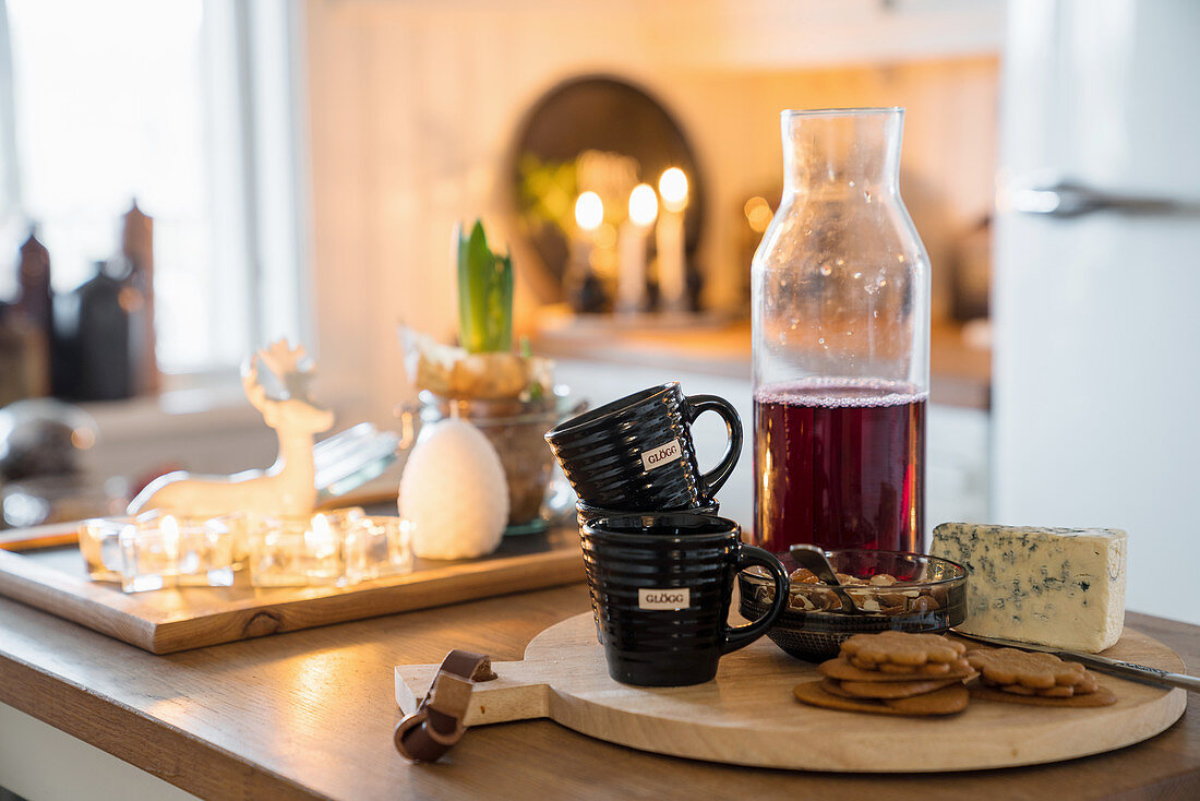 Cheese, biscuits, cups and mulled wine